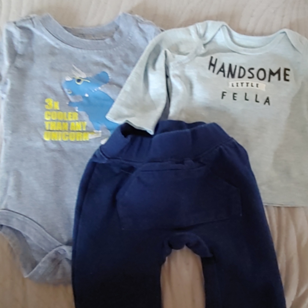 A onesie, blue pants with a long sleeve shirt
